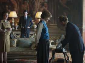 This image released by Netflix shows Olivia Colman, from left, Josh O'Connor and Emma Corrin in a scene from "The Crown." Season four premieres on Sunday, Nov. 15. (Des Willie/Netflix via AP)