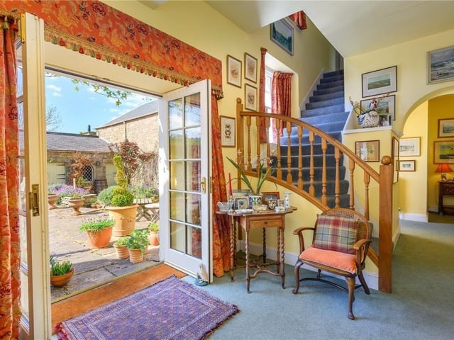 Main hall with French doors to the rear courtyard and garden.