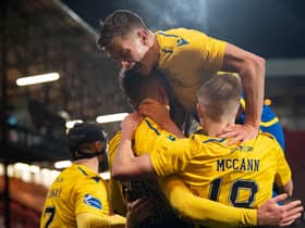 St Johnstone celebrate their victory at East End Park.