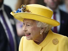 Queen Elizabeth II dressed in yellow at Paddington station in London, to mark the completion of London's Crossrail project.