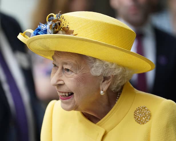 Queen Elizabeth II dressed in yellow at Paddington station in London, to mark the completion of London's Crossrail project.