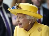Queen Elizabeth II dressed in yellow at Paddington station in London, to mark the completion of London's Crossrail project.