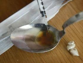 Suspected drug deaths have fallen in the latest figures for Scotland