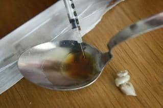 Suspected drug deaths have fallen in the latest figures for Scotland