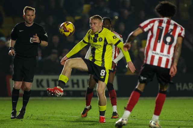 Harrogate Town midfielder has ‘agreed’ a deal with Scottish Championship outfit Ross County.