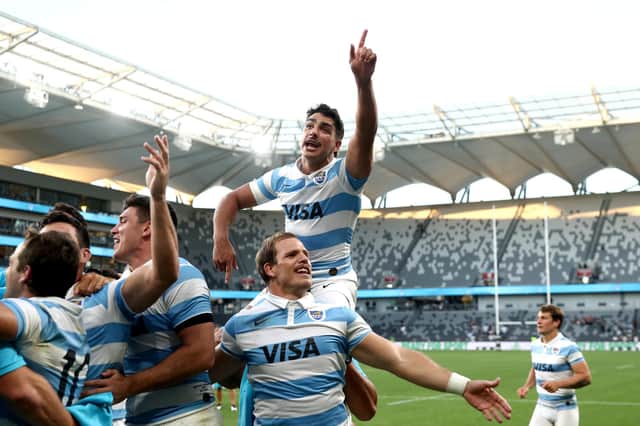 Argentina celebrate after their stunning win over New Zealand. Picture: Cameron Spencer/Getty Images