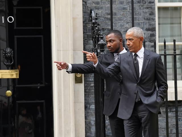 Former US president Barack Obama (right) leaves following a meeting at 10 Downing Street in London. Picture: Stefan Rousseau/PA Wire