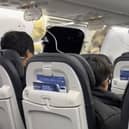 The gap left by the blown-out panel is visible in this image from video provided by Elizabeth Le from aboard the flight. (Photo by Elizabeth Le via AP)
