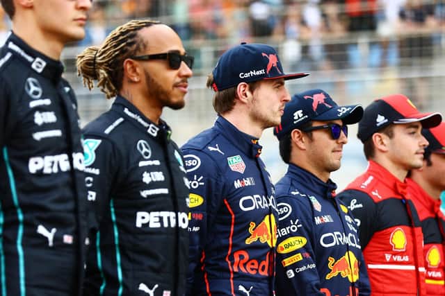 From left to right, George Russell, Lewis Hamilton, Max Verstappen, Sergio 'Checo' Perez, Charles Leclerc, and Carlos Sainz line up ahead of the Bahrain Grand Prix. Photo: Mark Thompson/Getty Images.