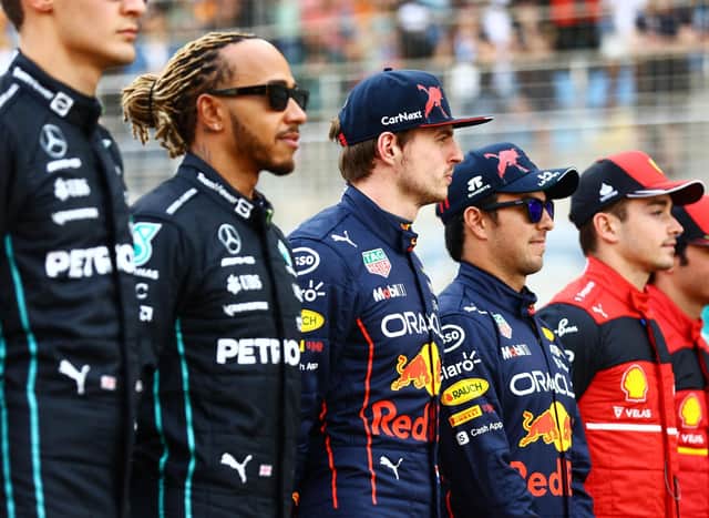From left to right, George Russell, Lewis Hamilton, Max Verstappen, Sergio 'Checo' Perez, Charles Leclerc, and Carlos Sainz line up ahead of the Bahrain Grand Prix. Photo: Mark Thompson/Getty Images.