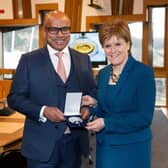 Sanjeev Gupta presents Nicola Sturgeon with a special commemorative medal cast from Lochaber aluminium in 2018, to mark two years since his group the GFG Alliance began investing in Scottish industry