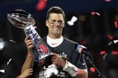 Tampa Bay Buccaneers quarterback Tom Brady (12) holds the Vince Lombardi trophy following the NFL Super Bowl 55 football game against the Kansas City Chiefs, Sunday,  (Ben Liebenberg via AP)