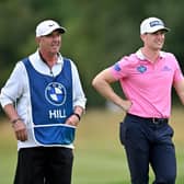 Calum Hill and experienced caddie Phil 'Wobbly' Morbey weigh up the Scot's second shot in the second round of the BMW International Open at Golfclub Munchen Eichenried. Picture; Stuart Franklin/Getty Images.