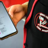 A pupil at Stonlelaw High School in Rutherglen, Glasgow, receives a text message with her exam grades on her mobile phone last year.