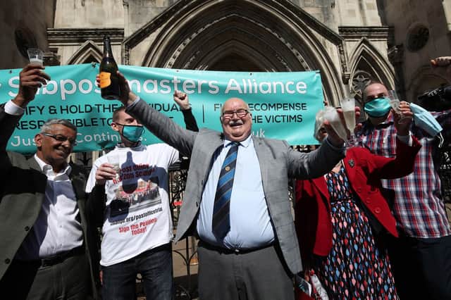 Former Post Office workers celebrate outside the Royal Courts of Justice in London yesterday after 39 had convictions for fraud, theft and false accounting overturned (Picture: Yui Mok/PA)