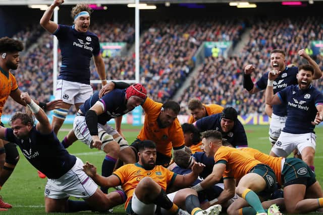 Hamish Watson is buried beneath the bodies as he goes over to score Scotland's first try against Australia. (Photo by Ian MacNicol/Getty Images)