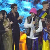 Kalush Orchestra from Ukraine celebrates after winning the Grand Final of the Eurovision Song Contest at Palaolimpico arena, in Turin, Italy, Saturday, May 14, 2022. (AP Photo/Luca Bruno)