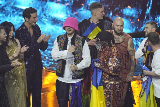 Kalush Orchestra from Ukraine celebrates after winning the Grand Final of the Eurovision Song Contest at Palaolimpico arena, in Turin, Italy, Saturday, May 14, 2022. (AP Photo/Luca Bruno)