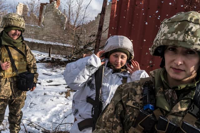 Ukrainian soldiers, from left, Ira, Katya and Alyona, on the front line with Russian-backed separatists in Pisky, Ukraine (Picture: Brendan Hoffman/Getty Images)