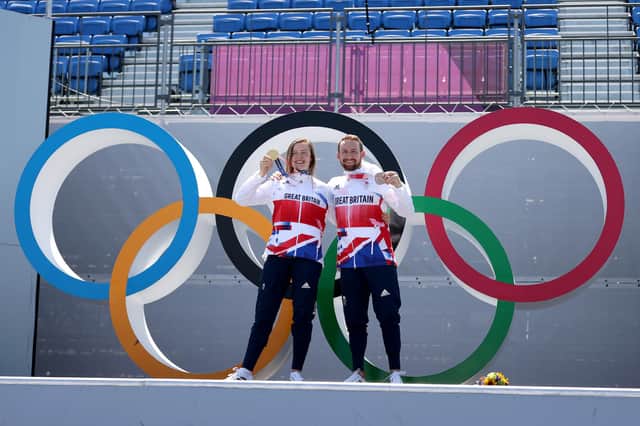 Charlotte Worthington and Declan Brooks show off their medals after the BMX Freestyle event