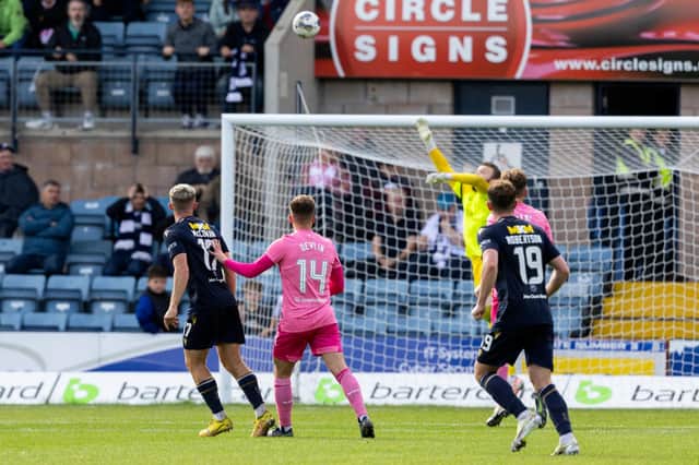 Dundee's Luke McCowan (L) send his shot over the head of Hearts goalkeeper Zander Clark and into the net. (Photo by Mark Scates / SNS Group)