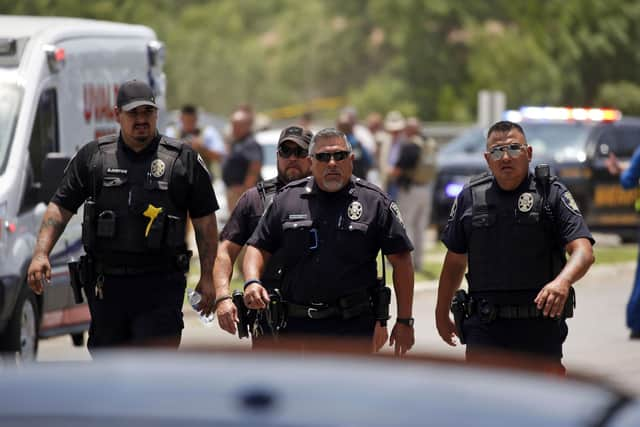 Police walk near Robb Elementary School following a shooting in Uvalde, Texas. (AP)