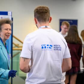HRH The Princess Royal meeting MRS funded researcher, Luca.