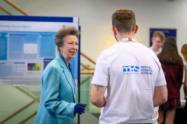 HRH The Princess Royal meeting MRS funded researcher, Luca.