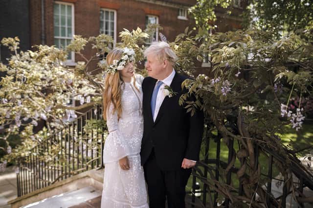 In this image released by Downing Street, Britain's Prime Minister Boris Johnson and Carrie Johnson pose together for a photo in the garden of 10 Downing Street after their wedding on Saturday. Picture: Rebecca Fulton/Downing Street via AP
