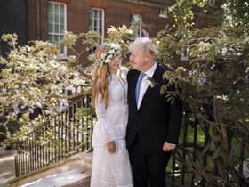 In this image released by Downing Street, Britain's Prime Minister Boris Johnson and Carrie Johnson pose together for a photo in the garden of 10 Downing Street after their wedding on Saturday. Picture: Rebecca Fulton/Downing Street via AP