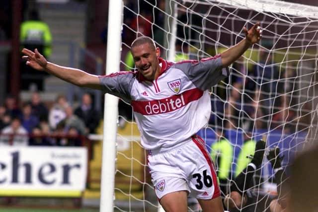 Sean Dundee celebrates after netting Stuttgart's equaliser at Tynecastle.