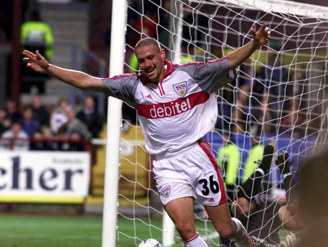 Sean Dundee celebrates after netting Stuttgart's equaliser at Tynecastle.