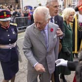 King Charles III reacts after an egg was thrown his direction as he arrived for a ceremony at Micklegate Bar in York