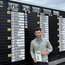 Englishman Haydn McCullen shows off his card after signing for a 59 in the first round of the Northern Open at Moray Golf Club in Lossiemouth