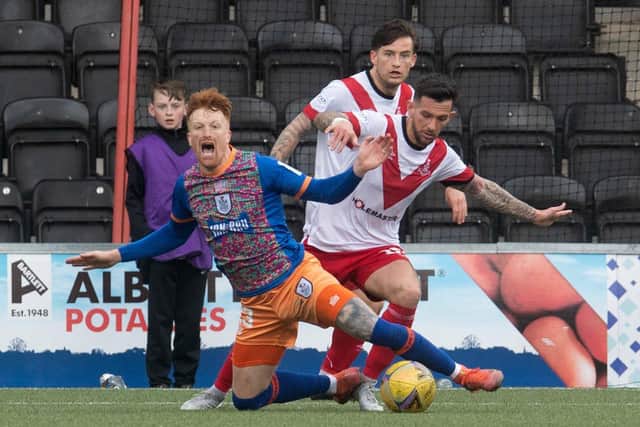 Simon Murray is fouled by Airdrie's Dylan Easton for the Queen's Park penalty.  (Photo by Craig Foy / SNS Group)