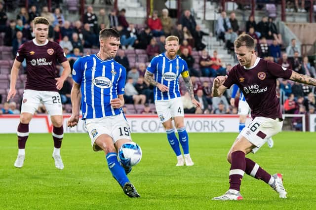 Hearts;' Andy Halliday (L) and Kilmarnock's Joe Wright in action during a Premier Sports Cup match at Tyneacescakst