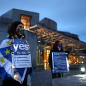 Pro-EU campaigners protest against Brexit outside the Scottish Parliament