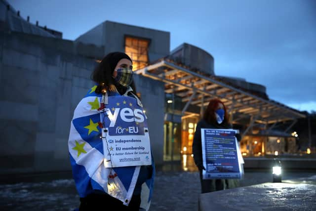 Pro-EU campaigners protest against Brexit outside the Scottish Parliament