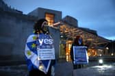 Pro-EU campaigners protest against Brexit outside the Scottish Parliament