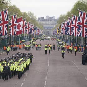 Metropolitan Police officers march along The Mall in London as they head to their positions for of the coronation processions of King Charles III and Queen Camilla.