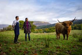 The Pierhouse chef Michael Leathley and farmer Jane Isaacson with a Highland Coo