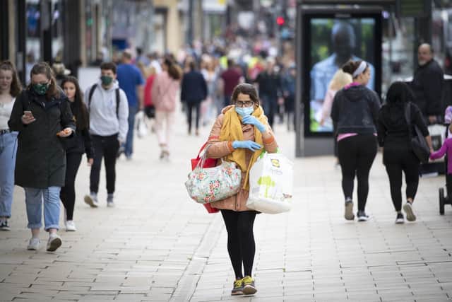 A shopper wears a protective face mask in Edinburgh's Princes Street.  Jane Barlow/PA Wire