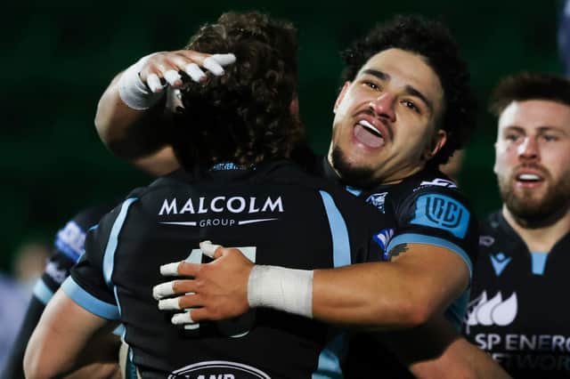 Glasgow's Sione Tuipulotu, pictured congratulating Josh McKay on his try, was singled out for praise by head coach Danny Wilson. (Photo by Craig Williamson / SNS Group)