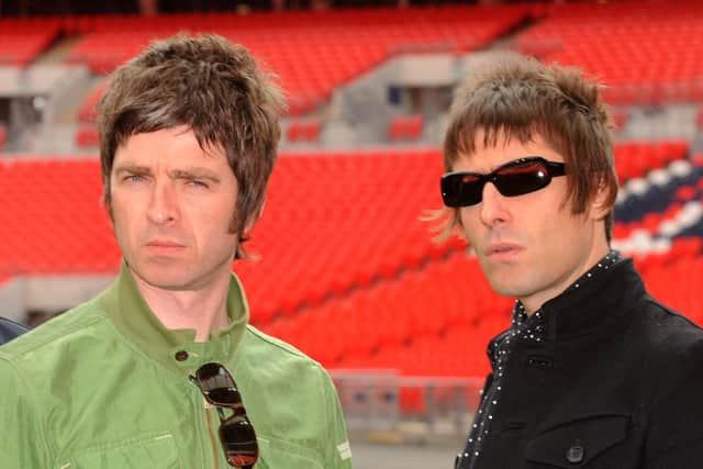 Oasis band members Noel Gallagher (left) and Liam Gallagher (right), during a photocall at Wembley Stadium. Zak Hussein/PA Wire