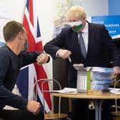 Boris Johnson, seen wearing a Welsh flag face mask during a visit to Barry during the Senedd election campaign, needs to be a 'minister for the Union' rather than a 'minister for unionists' (Picture: Matthew Horwood/Getty Images)