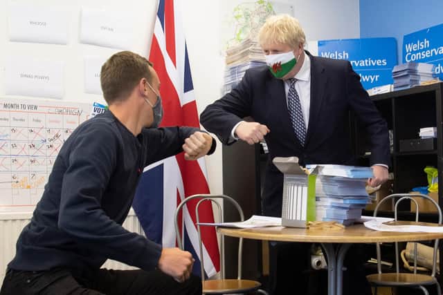 Boris Johnson, seen wearing a Welsh flag face mask during a visit to Barry during the Senedd election campaign, needs to be a 'minister for the Union' rather than a 'minister for unionists' (Picture: Matthew Horwood/Getty Images)