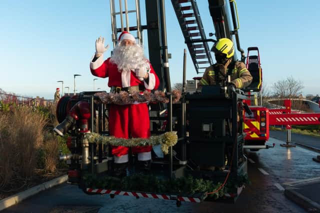 Firefighters used a high reach appliance to lift Santa up to the windows to wave to children after the pandemic scuppered a traditional visit at the Royal Aberdeen Children's Hospital.