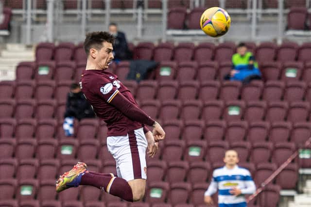 Jamie Walker rises high to recuse Hearts a point. Picture: SNS