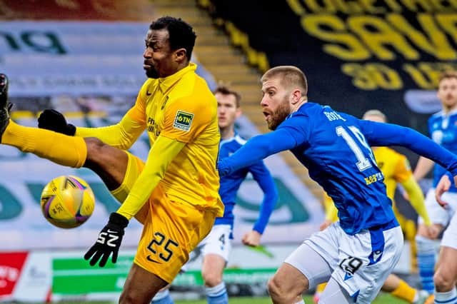 Livingston's Efe Ambrose in action against St Johnstone's Shaun Rooney during a recent clash. The teams meet at Hampden tomorrow in the final of the Betfred Cup. (Photo by Sammy Turner / SNS Group)