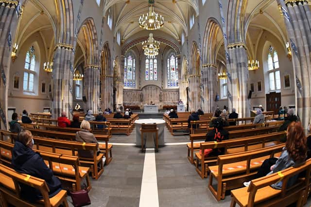 Canon Gerald Sharkey leads a socially-distanced mass at St. Andrew's Cathedral in Glasgow on March 26, as churches in Scotland were allowed to resume services.